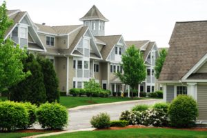 Row of modern townhouses with well-maintained landscaping.