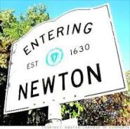 Sign indicating entry into Newton, established in 1630.